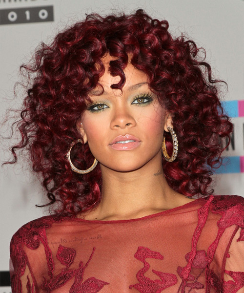 Rihanna with green eyes and red hair